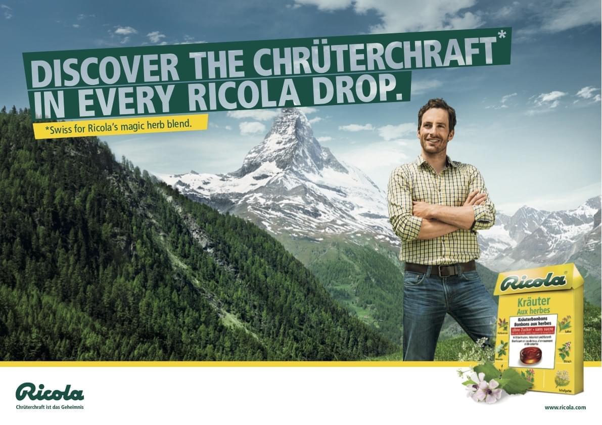 Ricola Chrüterchraft print ad featuring a young herb farmer in front of the Matterhorn panorama that says 'Discover the Chrüterchraft in every Ricola drop.'
